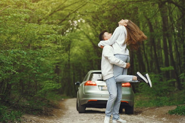 Free photo beautiful couple spend time in a spring forest