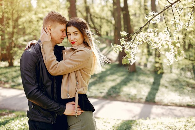 Beautiful couple spend time in a spring park