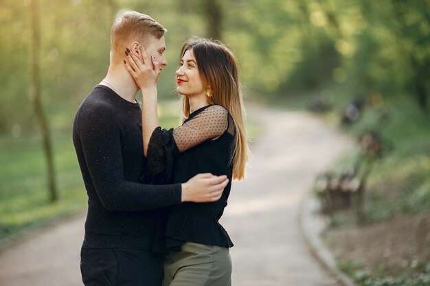 Beautiful couple spend time in a spring park