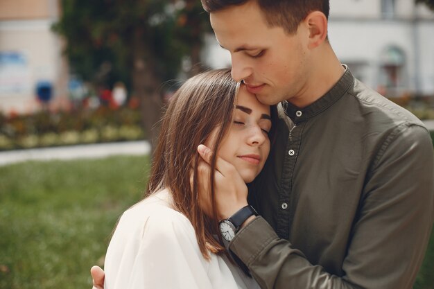 Beautiful couple spend time in a summer city