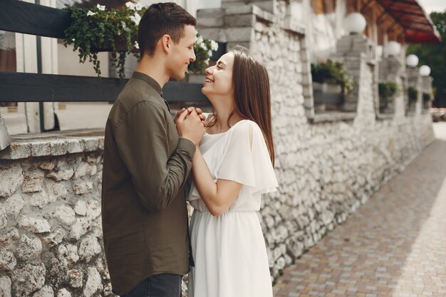 Beautiful couple spend time in a summer city