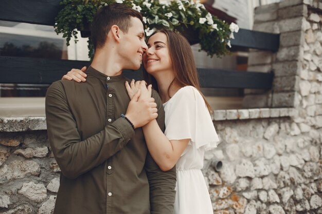 Beautiful couple spend time in a summer city