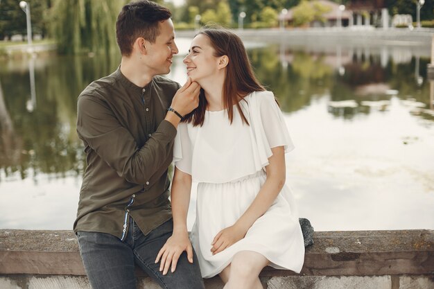 Beautiful couple spend time in a summer city