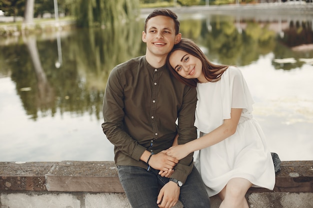 Beautiful couple spend time in a summer city