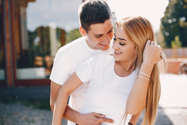 Beautiful couple spend time in a summer city