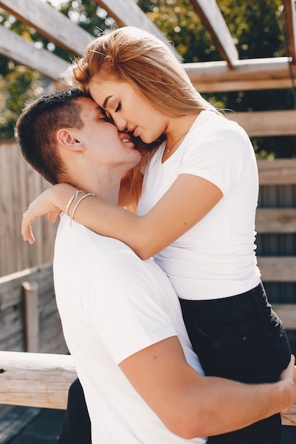 Beautiful couple spend time in a summer city