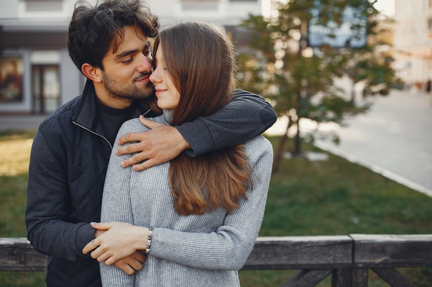 Beautiful couple spend time in a summer city