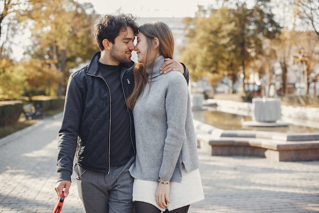 Beautiful couple spend time in a summer city