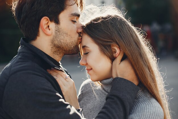 Beautiful couple spend time in a summer city