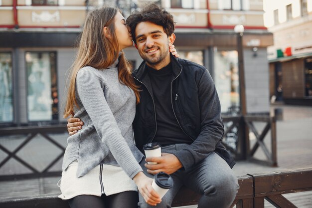 Beautiful couple spend time in a summer city