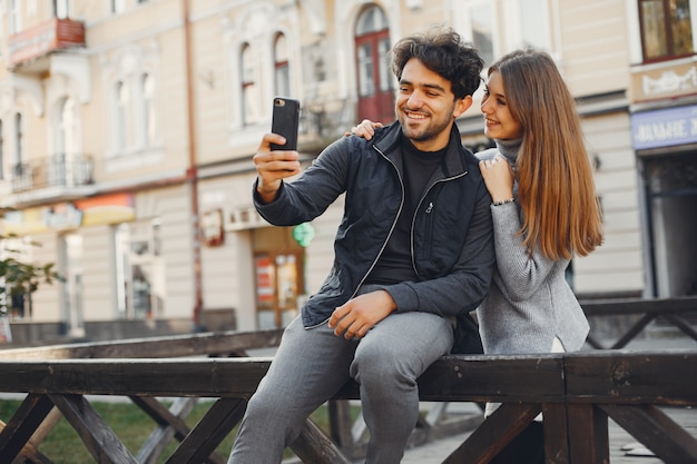 Beautiful couple spend time in a summer city