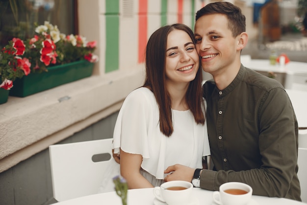 Beautiful couple spend time in a summer city