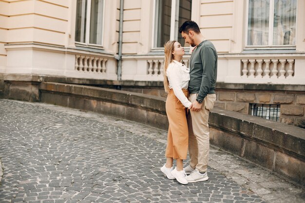 Beautiful couple spend time in a summer city