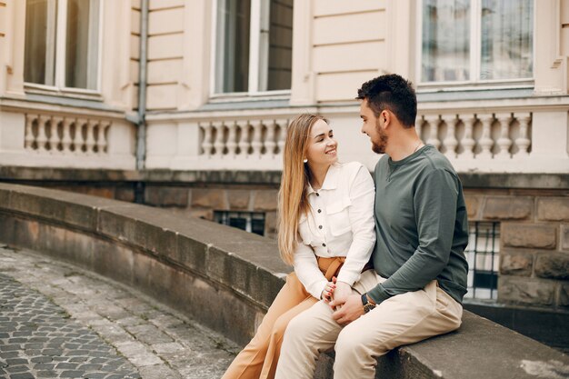 Beautiful couple spend time in a summer city