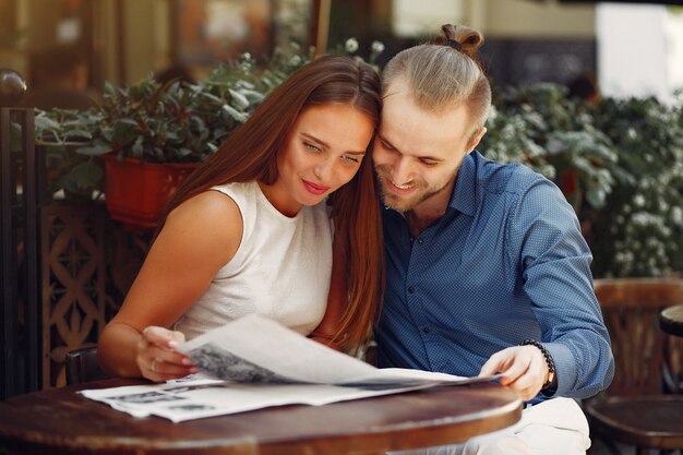 Beautiful couple spend time in a summer city