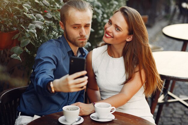 Beautiful couple spend time in a summer city