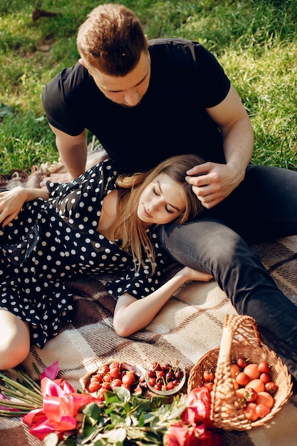 Free photo beautiful couple spend time in a summer field