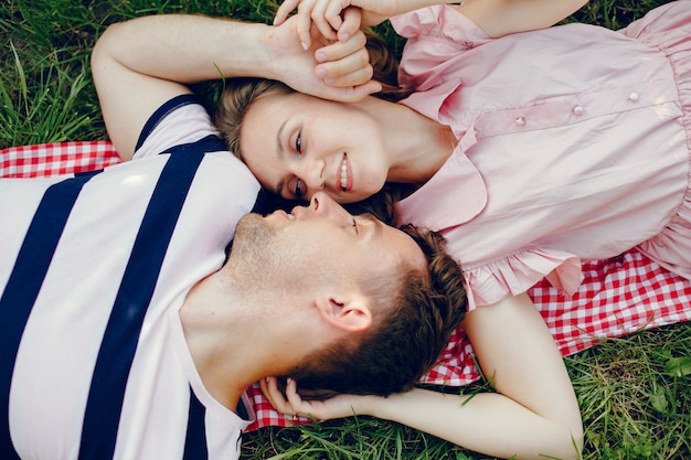 Beautiful couple spend time on a summer field