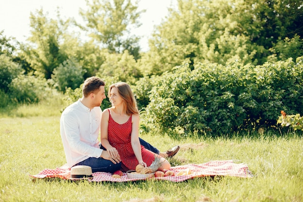 Beautiful couple spend time on a summer field