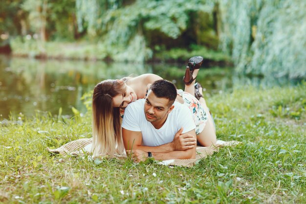 Beautiful couple spend time on a summer field