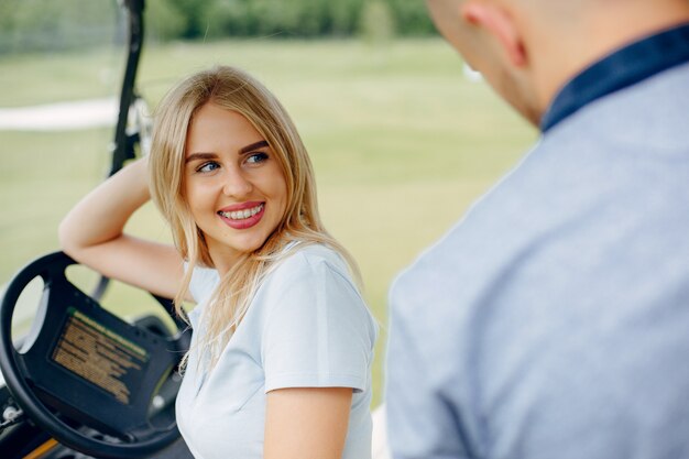 Beautiful couple spend time on a summer forest