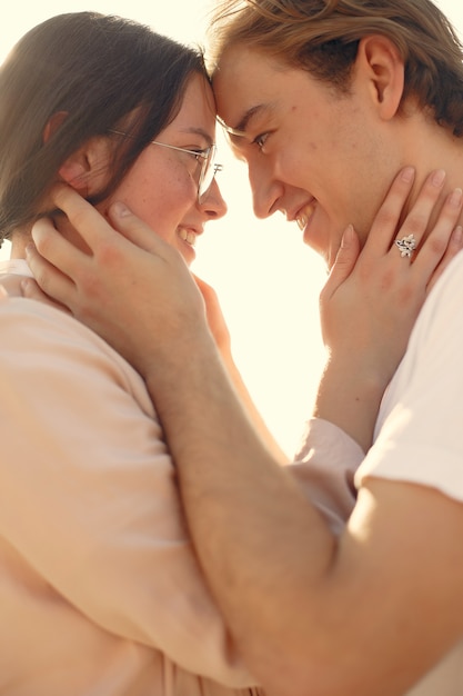 Beautiful couple spend time on a summer forest