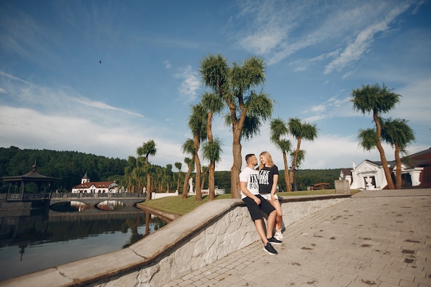 Free photo beautiful couple spend time in a summer garden