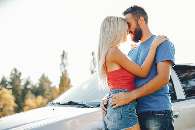 Beautiful couple spend time in a summer park