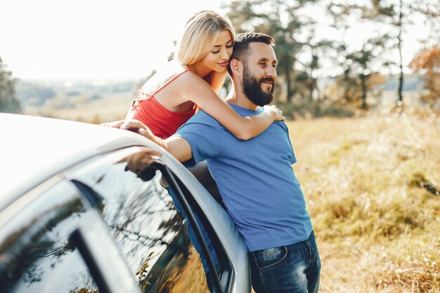 Beautiful couple spend time in a summer park