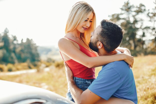 Beautiful couple spend time in a summer park