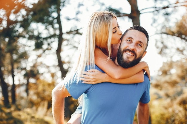 Beautiful couple spend time in a summer park