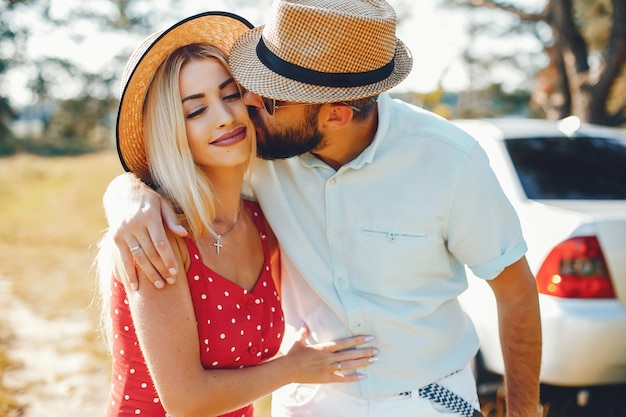 Beautiful couple spend time in a summer park