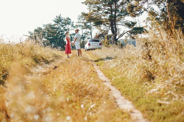 Beautiful couple spend time in a summer park