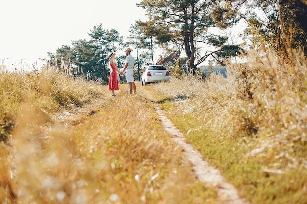 Beautiful couple spend time in a summer park