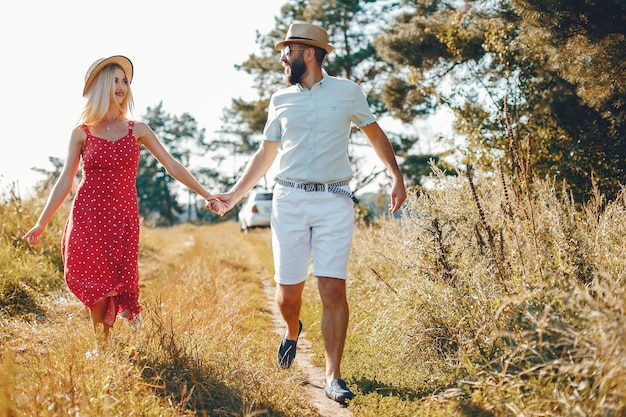 Beautiful couple spend time in a summer park