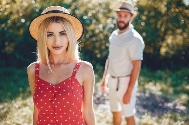 Beautiful couple spend time in a summer park