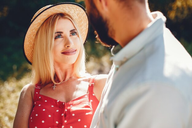 Beautiful couple spend time in a summer park