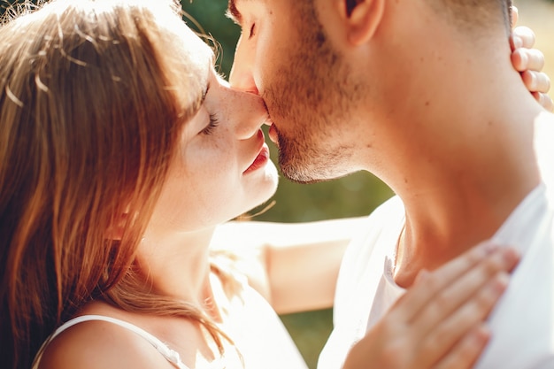 Free photo beautiful couple spend time in a summer park