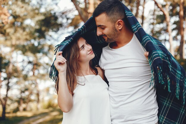 Beautiful couple spend time in a summer park