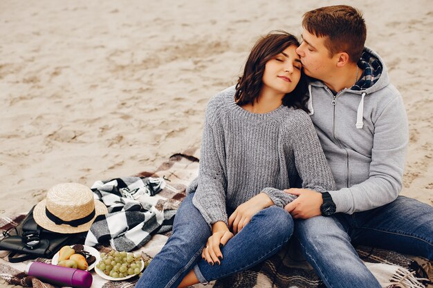 Beautiful couple spend time in a summer park