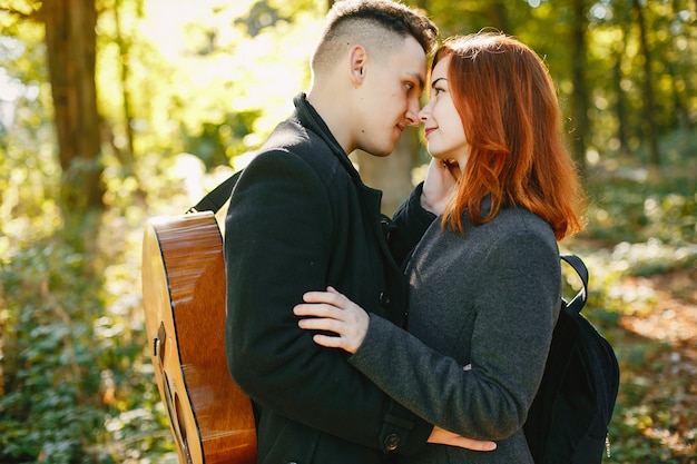 Beautiful couple spend time in a summer park