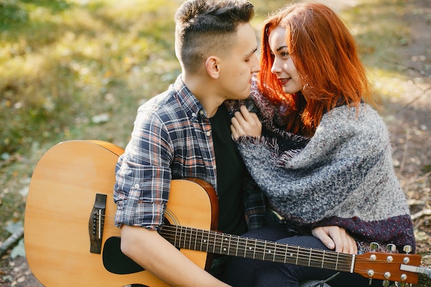 Beautiful couple spend time in a summer park