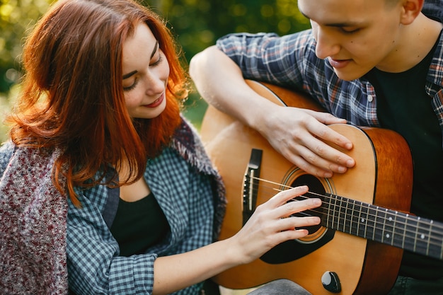 Free photo beautiful couple spend time in a summer park