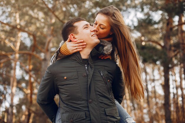 Beautiful couple spend time in a summer park