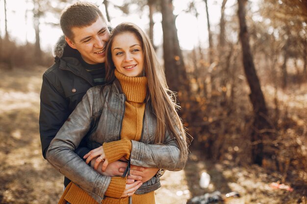 Beautiful couple spend time in a summer park