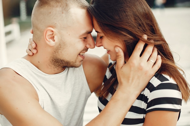 Beautiful couple spend time in a summer park