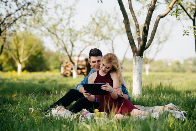 Beautiful couple spend time in a summer park