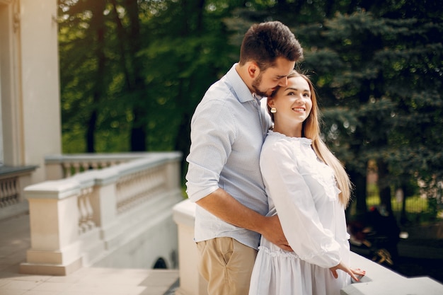 Beautiful couple spend time in a summer park