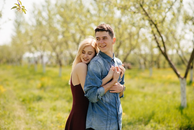 Beautiful couple spend time in a summer park