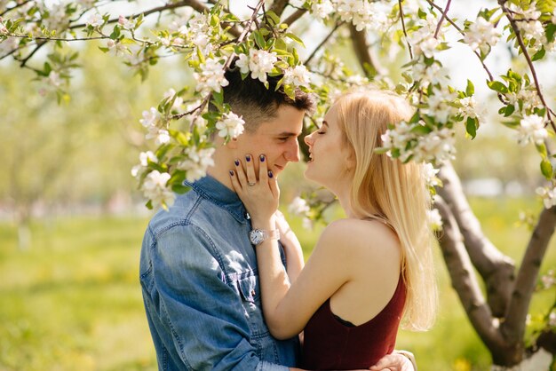 Beautiful couple spend time in a summer park